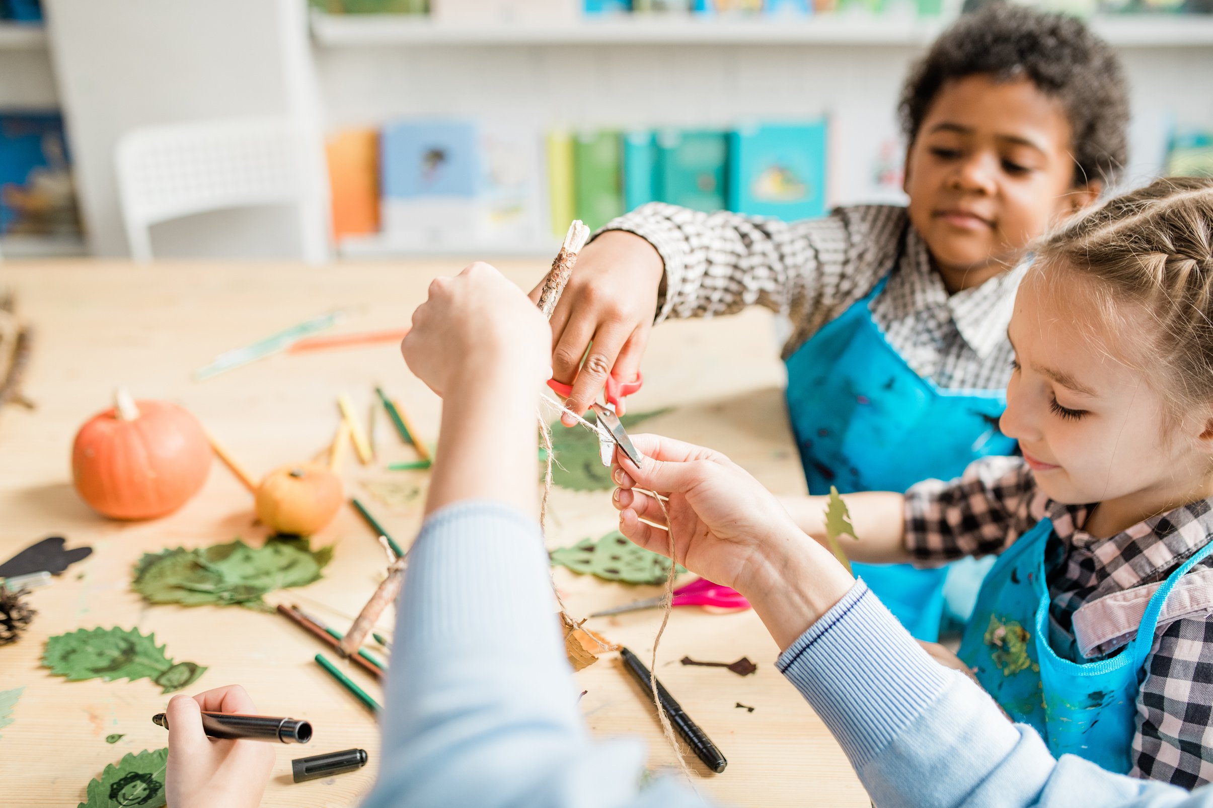 Teacher and Preschool Kids Making Arts and Crafts 